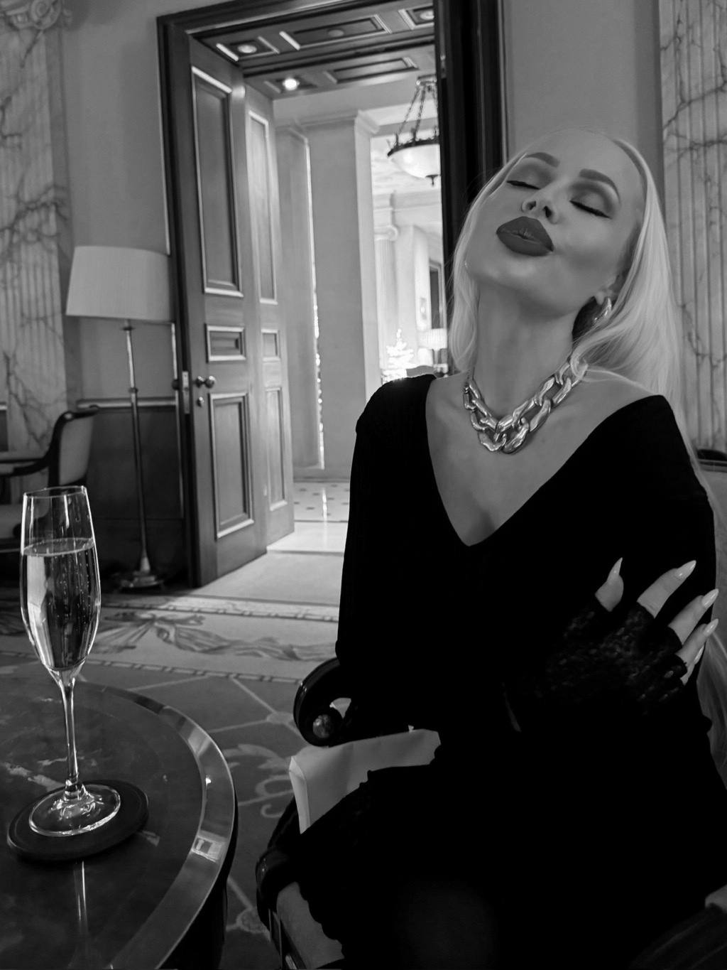 Dressed in black for dinner, gold at the collar
